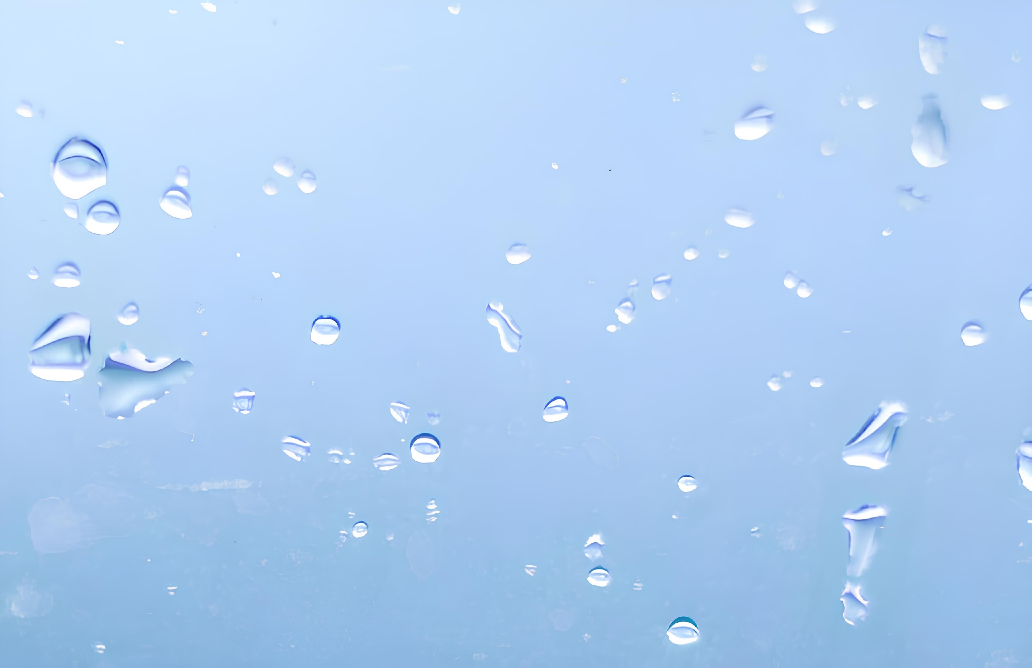 Image de fond du site en bleu clair avec des goutes d'eau